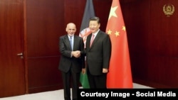 Ооган президенти Ашраф Гани Кытай лидери Си Цзиньпин менен жолуккан учур. 9-июнь, 2017-жыл.