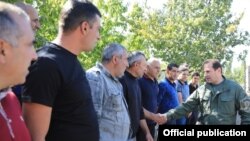 Armenia -- Defense Minister Davit Tonoyan (R) greets reservists called up for military exercises, September 24, 2019.