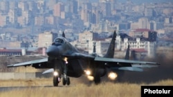 Armenia - A Russian MiG-29 fighter jet takes off from a military airport in Yerevan, 14Mar2014.