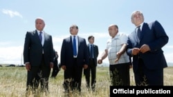Armenia -- Minister of Agriculture Sergo Karapetian (L) and Prime Minister Hovik Abrahamian (second from left) visit a wheat field in Shirak region, 9 July, 2014