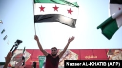 Сириянын өкмөтүнө каршы жана абактагыларды бошотууну талап кылган демонстрация. Алеппо аймагы, 28-сентябрь, 2018-жыл
