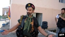 Armenia -- An armed man speaks to the press after pro-opposition gunmen locked in a week-long hostage standoff with Armenian authorities released the final four police officers held captive in Yerevan, July 23, 2016