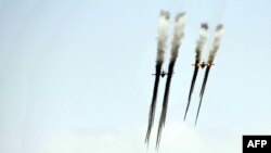 Armenia -- Armenian army Sukhoi Su-25 ground attack aircrafts fire during a military exercise, September 11, 2015