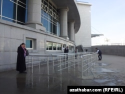 turkmenistan. people in front of 'ice palace" in ashgabat