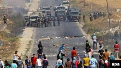 Палестина жарандары менен Израил аскерлери. 8-август, 2014-жыл.