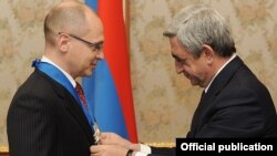 Armenia - President Serzh Sarkisian (R) awards a Medal of Honor to Sergei Kirienko, head of Rosastom nuclear energy corporation, 7Feb2012.
