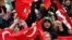 Turkey -- Turkish Muslim protestors shout slogans holding Turkish and Islamic flags during a demonstration in Istanbul, Turkey, 19Feb2006