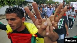 Люди відзначають угоду про примирення між протиборчими палестинськими угрупованнями «Фатх» і «Хамас», Газа, 4 травня 2011 року