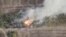 A still pictures from a drone footage shows military hardware on fire near Svitle