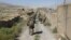 U.S. military advisers from the 1st Security Force Assistance Brigade walk at an Afghan National Army base in Maidan Wardak Province in 2018. (file photo)