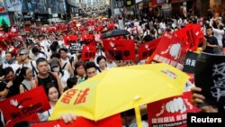 Гонконгдогу митингдин катышуучулары. 