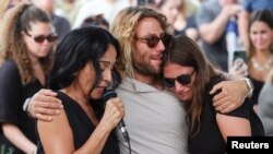 ریتا در مراسم یادبود یک زن و شوهر اسرائیلی کشته شده در حمله حماس