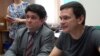 Vadim Prokhorov (left) in a Moscow court with Ilya Yashin, one of several Russian opposition figure whom he has defended. 
