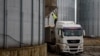 A truck carrying corn is seen at a grain storage facility in the village of Bilohirya, Khmelnytskyiy region, Ukraine.