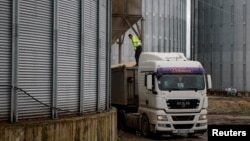 A truck carrying corn is seen at a grain storage facility in the village of Bilohirya, Khmelnytskyiy region, Ukraine.