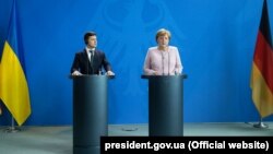Президент України Володимир Зеленський і канцлер Німеччини Анґела Меркель. Берлін, 18 червня 2019 року