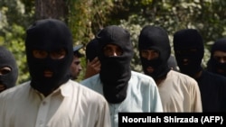 Alleged fighters for the Islamic State and Taliban in Afghanistan