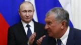 Владимир Путин и глава "Роснефти" Игорь Сечин