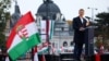 Peter Magyar, leader of the opposition Tisza party, delivers a speech in Budapest at a rally to mark the 69th anniversary of the 1956 Hungarian uprising.