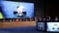 CROATIA – Ukraine's President Volodymyr Zelenskyy appears on screens as he speaks via a video link at the opening session of the International Crimea Platform summit, organised by Ukraine and Croatia, in Zagreb, on October 25, 2022 