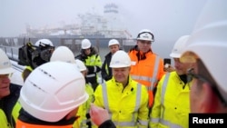 German Chancellor Olaf Scholz (center) attends the opening of the LNG terminal in Wilhelmshaven on December 17.