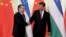 Shavkat Mirziyoev (left) and Chinese President Xi Jinping have met several times since the Uzbek leader came to power in 2016. (file photo)