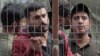 Migrants detained in Lithuania after crossing the border from Belarus.