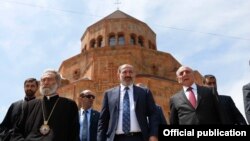 Nagorno-Karabakh -- Armenian Prime Minister Nikol Pashinian (C), Karabakh President Bako Sahakian (R) and Archbishop Pargev Martirosian leave a newly built church in Stepanakert, May 9, 2019.