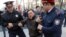 KAZAKHSTAN -- Police officers detain an anti-government protester during a rally in Almaty, Kazakhstan March 22, 2019. 