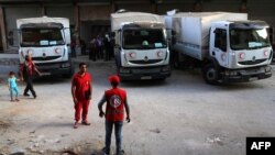 در تصویری از ماه اوت؛ گروهی از امدادرسانان هلال احمر سوریه در اطراف دمشق