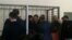 Подсудимых по делу «Таблиги Джамаат» заводят в зал суда. Астана, 22 января 2016 года.
