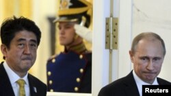 Прем'єр-міністр Японії Сіндзо Абе та президент Росії Володимир Путін