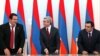 Armenia -- President Serzh Sarkisian (C), Orinats Yerkir Party leader Artur Baghdasarian (R) and Prosperous Armenia Party leader Gagik Tsarukian sign a new coalition agreement, 17Feb2011.