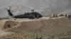 U.S. soldiers are pictured near a UH-60 Black Hawk helicopter during a recovery operation in Nangarhar Province in 2013.
