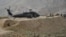 U.S. soldiers are pictured near a UH-60 Black Hawk helicopter during a recovery operation in Nangarhar Province in 2013.
