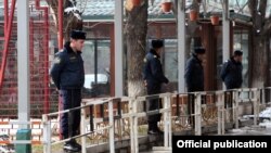 Armenia - Police officers guard kiosks built in Yerevan's Mashtots Park, 13Mar2012.