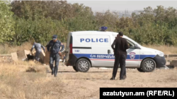 Armenia - Police are seen near the scene of a deadly shooting in the village of Merdzavan, September 24, 2025.