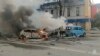 Russian firefighters extinguish fires in blazing cars following what local authorities say was a Ukrainian military strike on the city of Belgorod, in a photograph published on January 5.