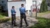 Belarusian police officers during a raid on the a news agency in Minsk on August 7.