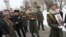 Armenia - An honor guard holds the picture of Sergeant Armen Hovannisian during his state funeral in Yerevan's Yerablur military cemetery, 22Jan2014.