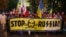 Poland -- People hold a banner with the words 'Stop Russia' during a march, commemorating the 75th anniversary of the Soviet Union's invasion of the eastern part of Poland at the outbreak of World War II, in front of Russian embassy in Warsaw, September 1