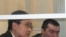 Дмитрий Тян (слева) и Олег Евлоев на скамье подсудимых. Астана, 31 марта 2009 года. 