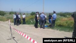 Armenia - Law-enforcement officials inspect the site of the murder of Russian serviceman Ivan Novikov in Gyumri, 15 June, 2015