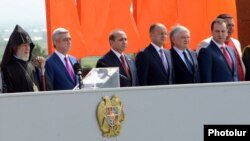 Armenia - Businessman Gagik Tsarukian (R) stands alongside President Serzh Sarkisian and other officials during the celebration of Republic Day at the Sardarapat war memorial, 28May2013.