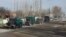 A group of trucks with relief supplies from Uzbekistan to the Sokh exclave arrive at a checkpoint.