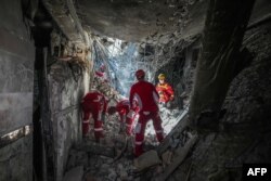 تصویری که ابتدا خبرگزاری میزان از جست‌وجوی امدادگران در مجموعه زندان اوین منتشر کرد