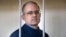 Paul Whelan stands in the defendant's cage while waiting for a hearing in a courtroom in Moscow in August 2019.