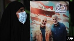 Учасниця акції пам’яті Касема Солеймані та Абу-Магді аль-Мугандіса, Багдад, 2 січня