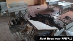 Damage can be seen at a school in the village of Maksat, in Batken Province's Leilek district on May 2.