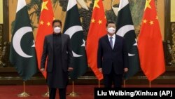 Pakistani Prime Minister Imran Khan and Chinese President Xi Jinping pose for a photo before a bilateral meeting in Beijing on February 6. 